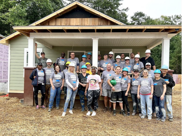 Group of volunteers building Habitat house.